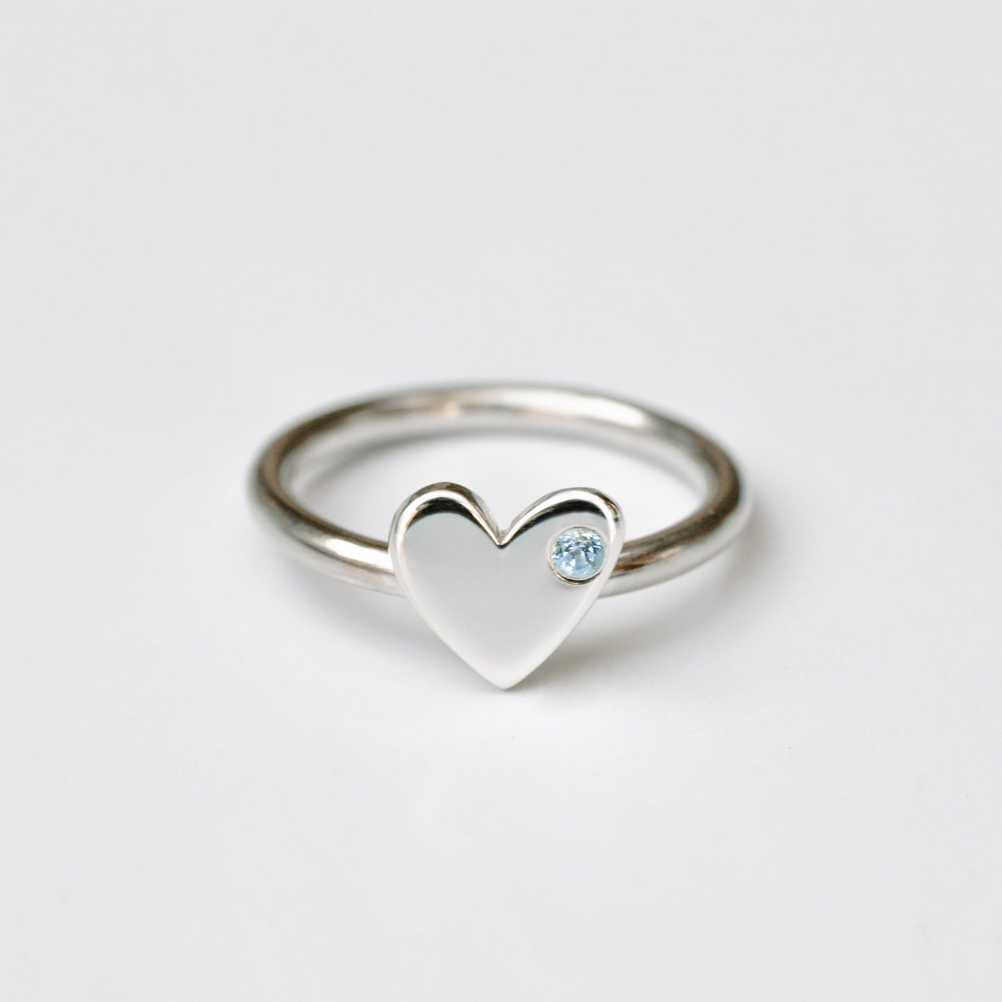Anillo Corazón plata + topacio azul